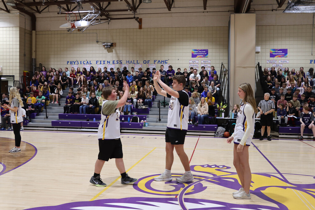 SGI Unified teammates high five. 
