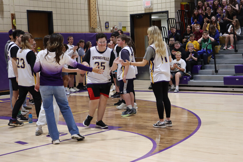 Dominic enters the court. 