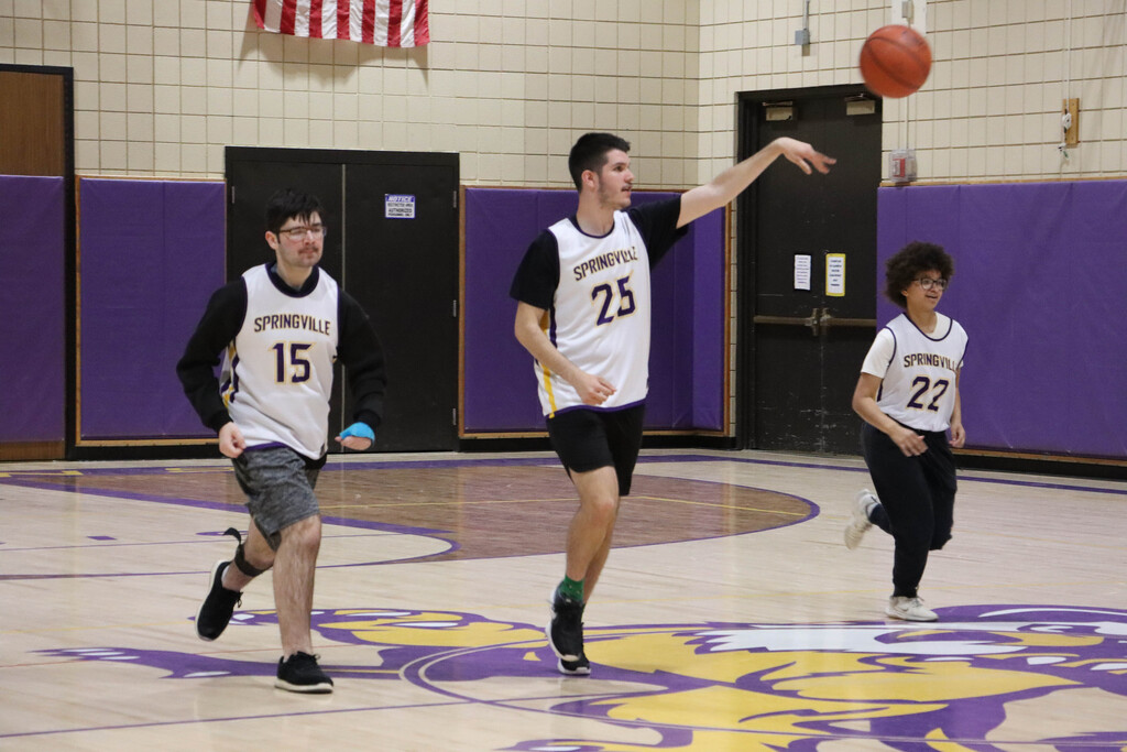 SGI dribbles the ball down the court. 