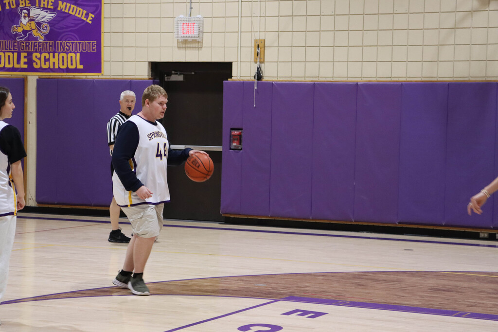 SGI dribbles the ball down the court. 