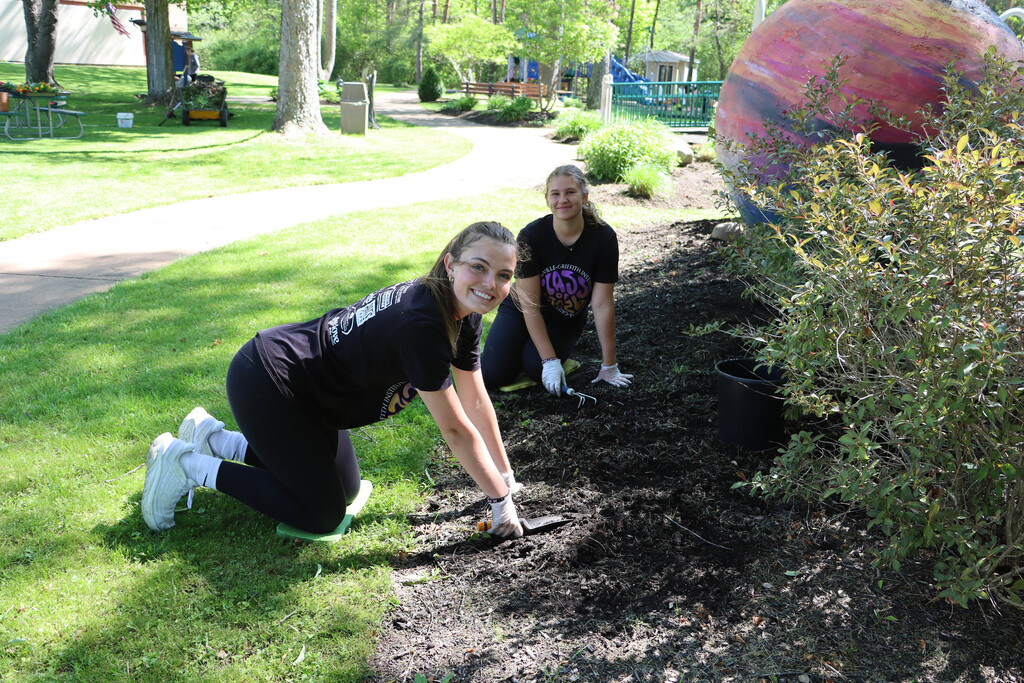 Two seniors garden at the Children's League.