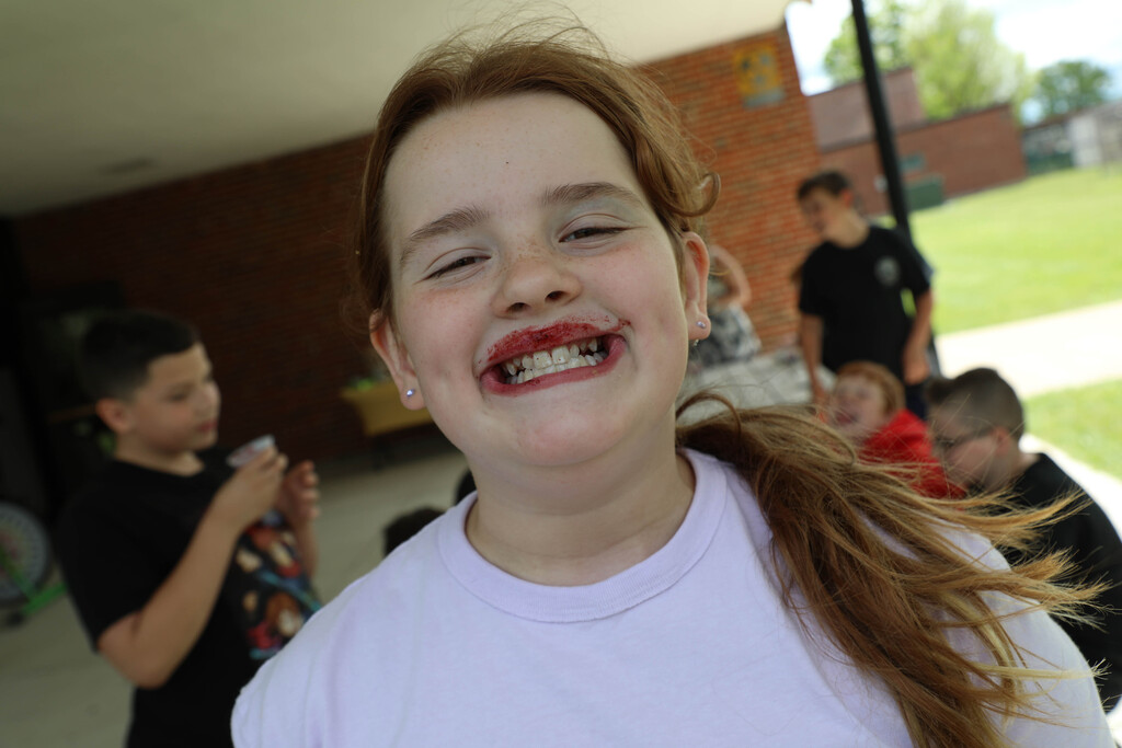 A student sports a smoothie mustache. 