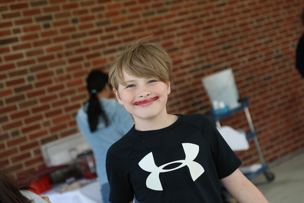A student sports a smoothie mustache. 