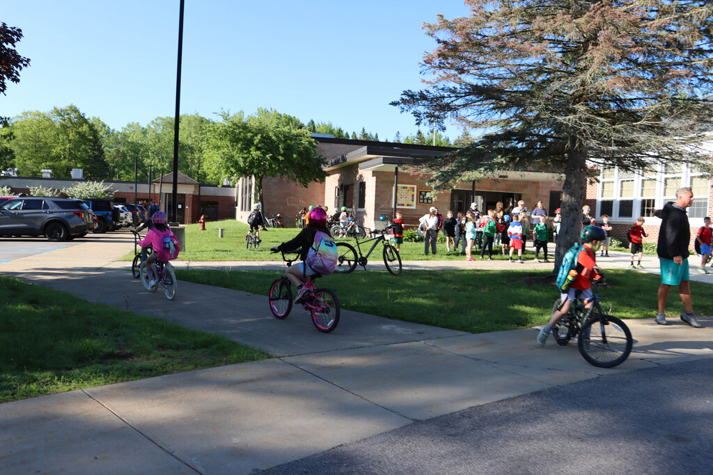 Students pull into the school for snacks. 