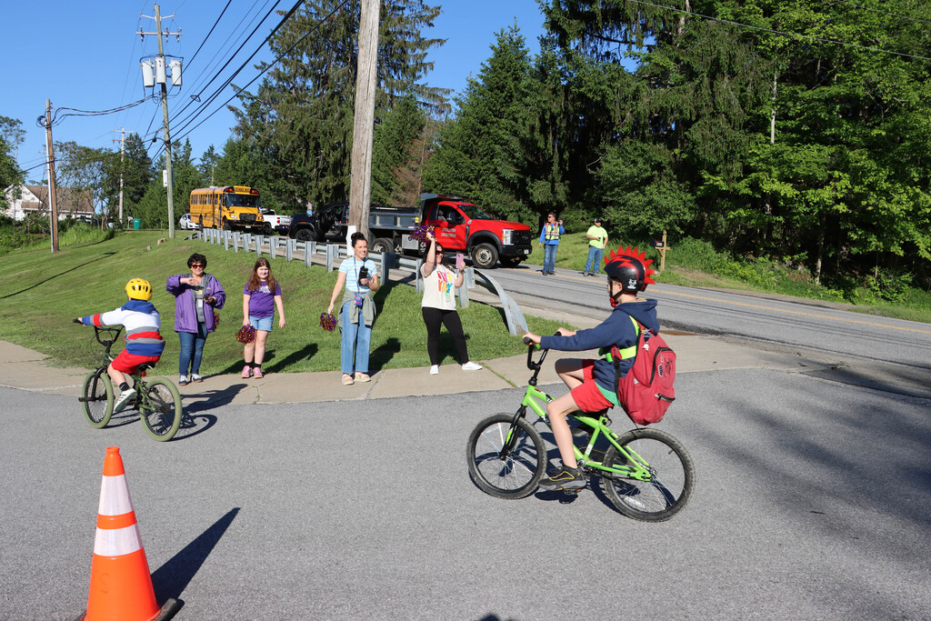 Students are cheered on by volunteers. 