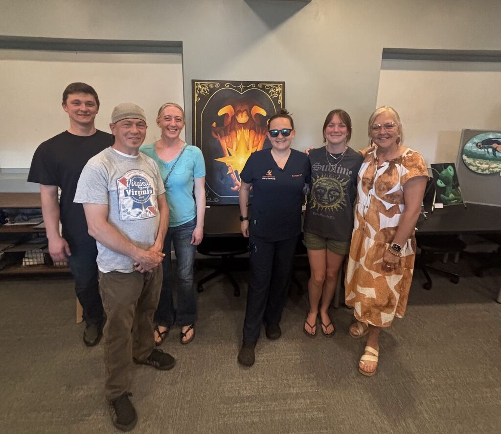 Students with their artwork.