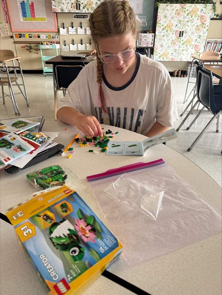Student assembles Legos. 