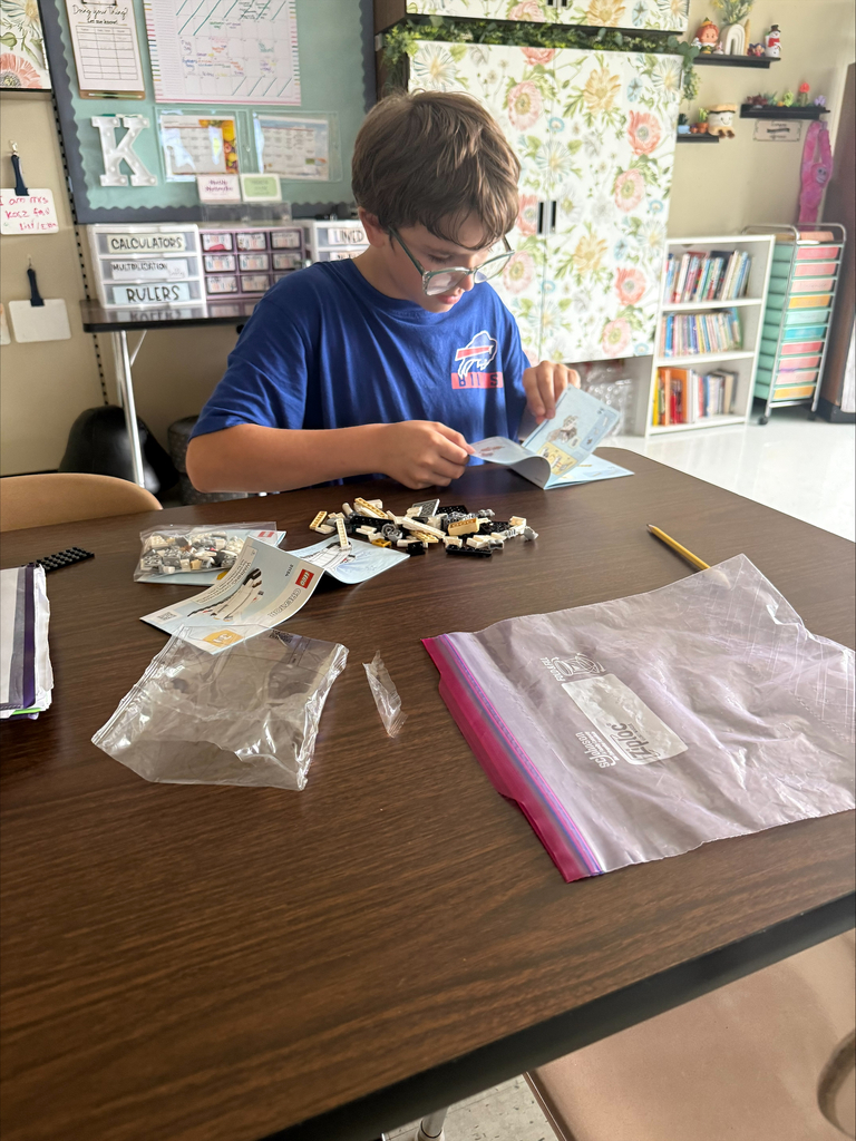 Student assembles Legos. 
