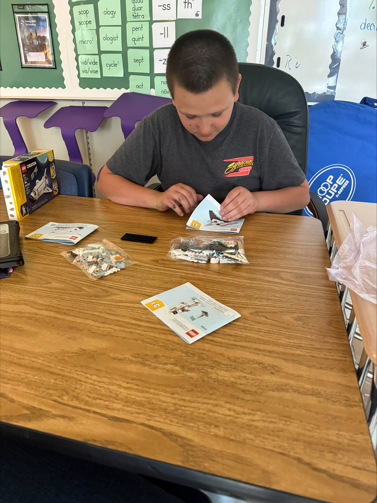 Student assembles Legos. 