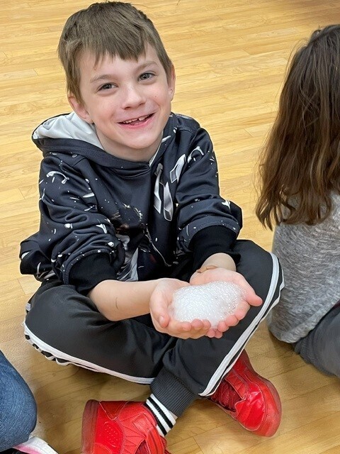 A student holds snow