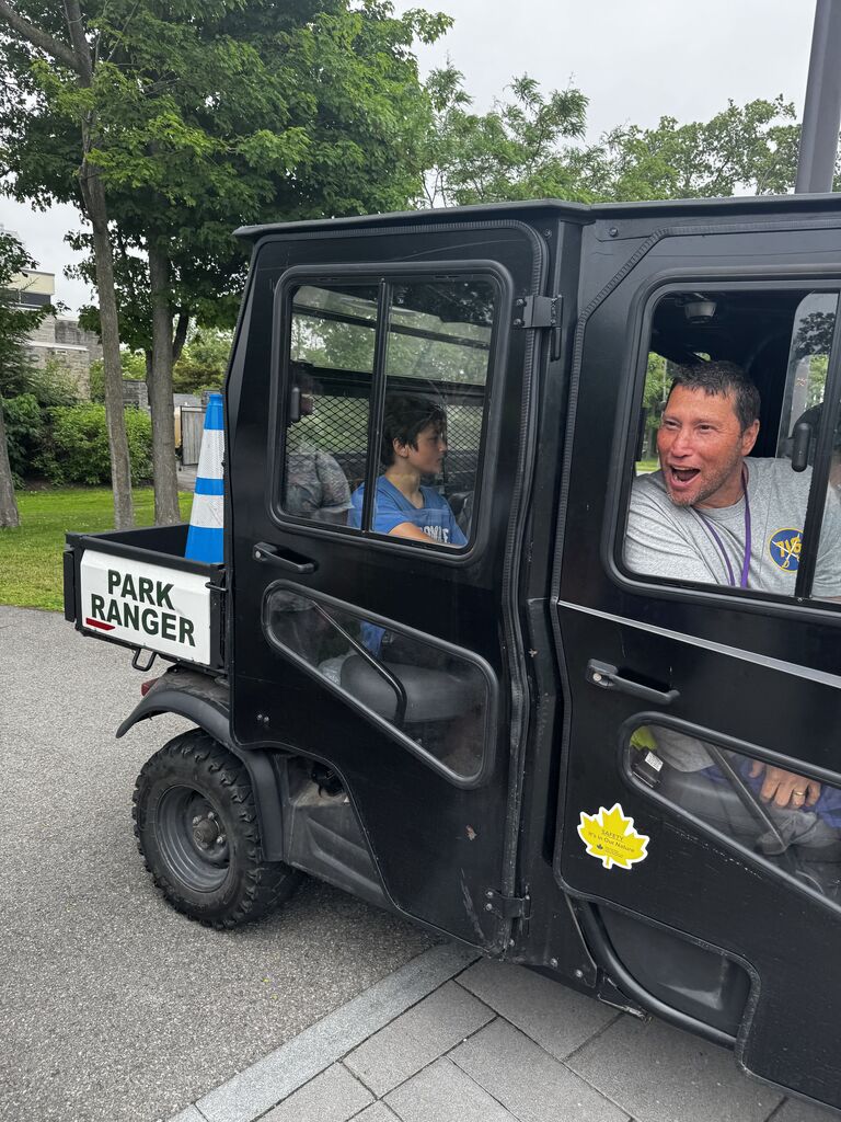Mr. Reese in a Park Ranger vehicle.
