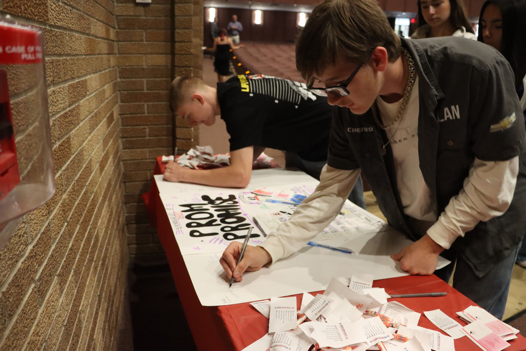 Signing Prom Promise poster. 