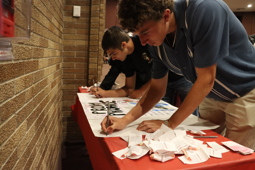 Signing Prom Promise poster. 