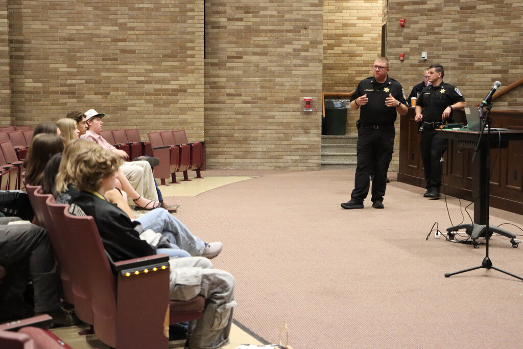 Deputies speak to students. 