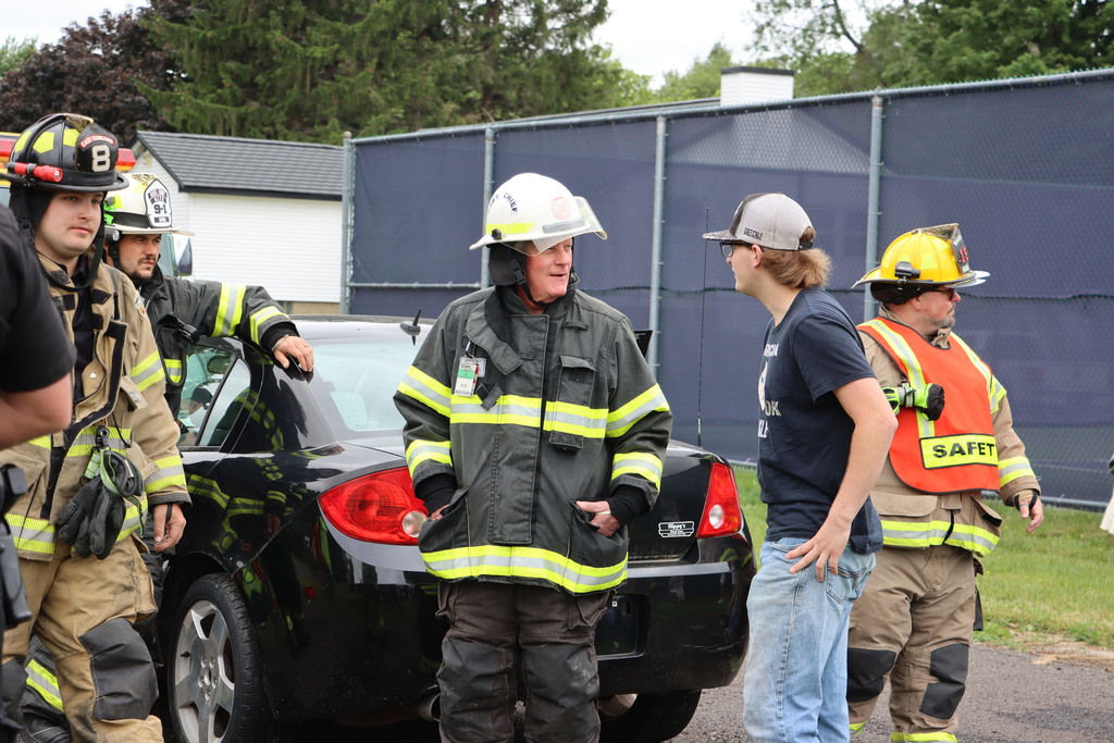 Student speaks to a first responder. 