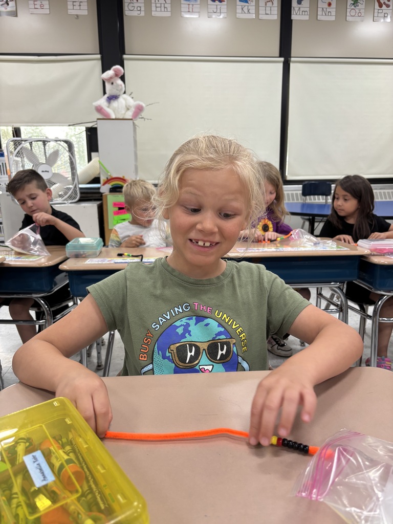 student makes a bracelet. 