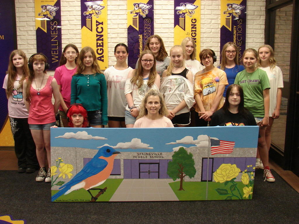 Art Club group photo with canvas.