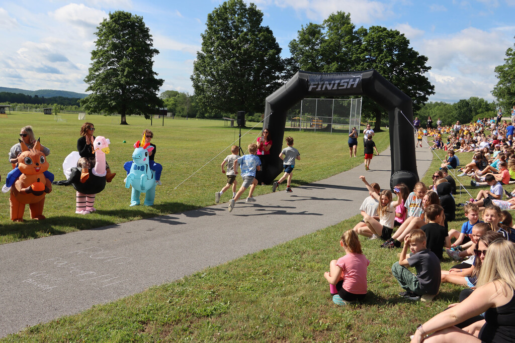 Students run the track. 
