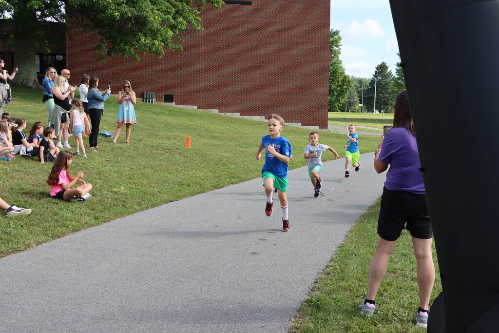 Students run the track. 