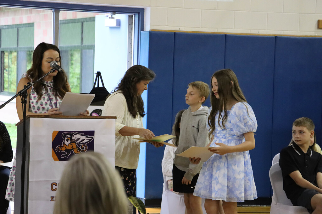 Student accepts their certificate. 