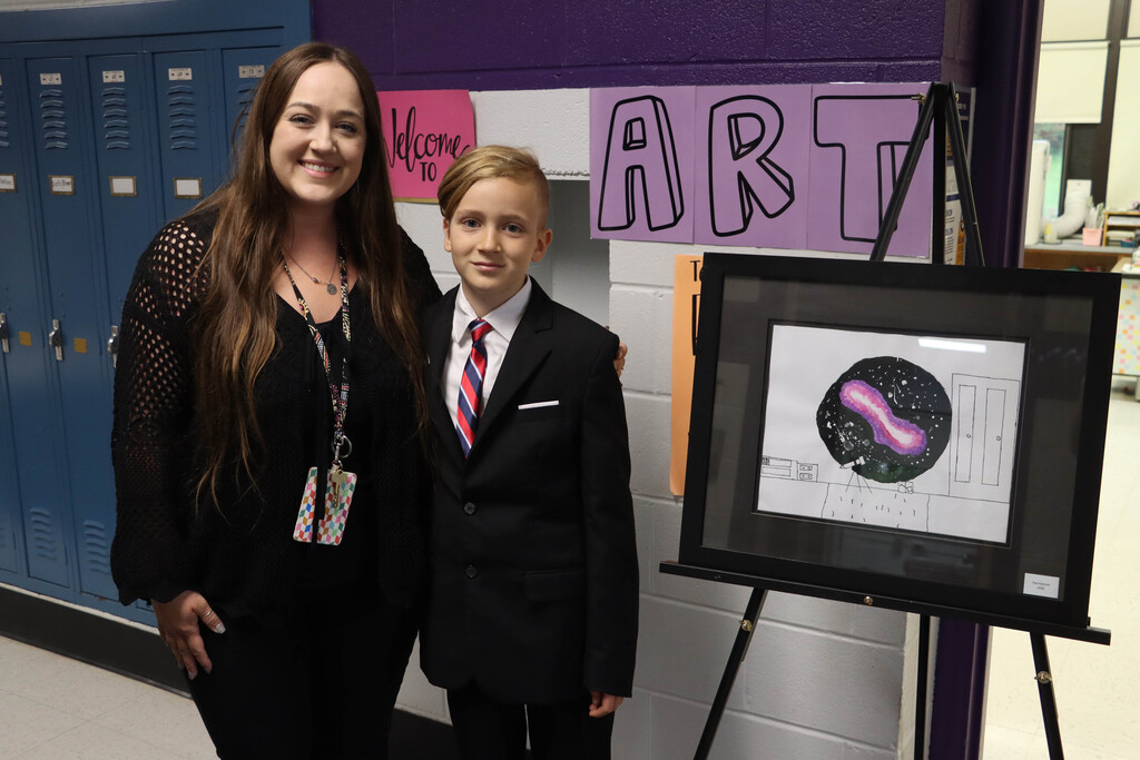 Student, teacher and artwork. 