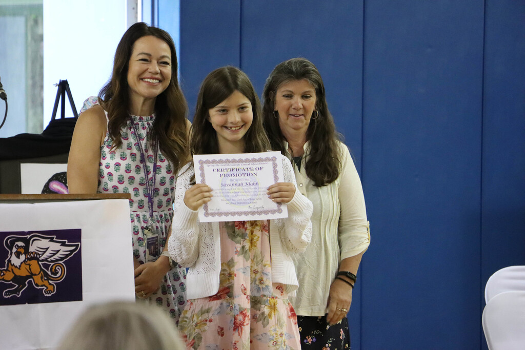 Student accepts their certificate. 