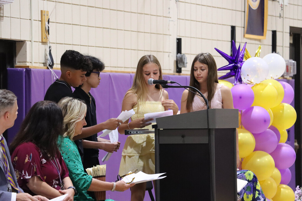 Student council reads superlative award winners. 