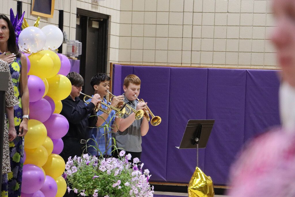 Student trumpeters play the National Anthem. 