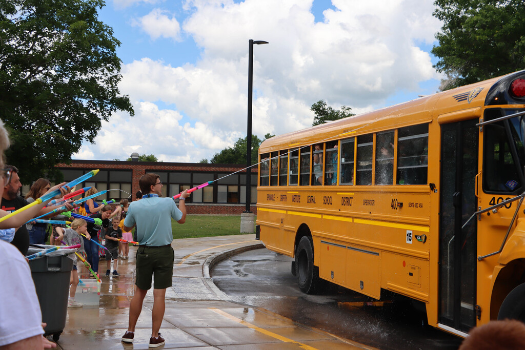 Staff sprays students with water. 