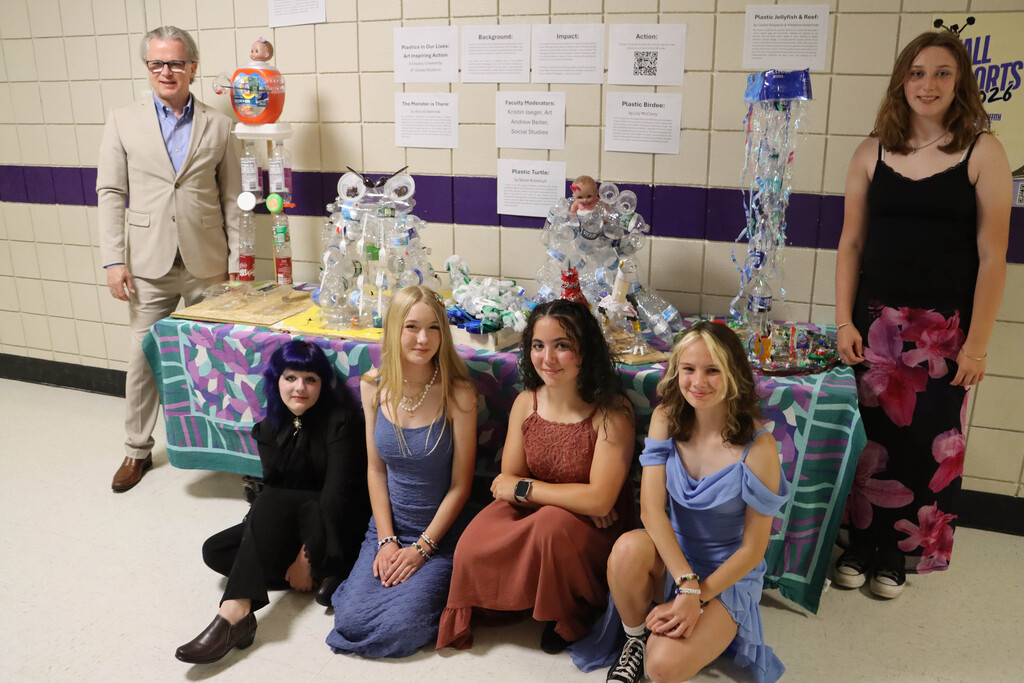 Students and Mr. Beiter with the sculptures. 