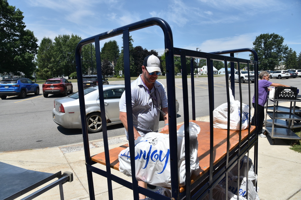 Culinary staff grab lunches. 