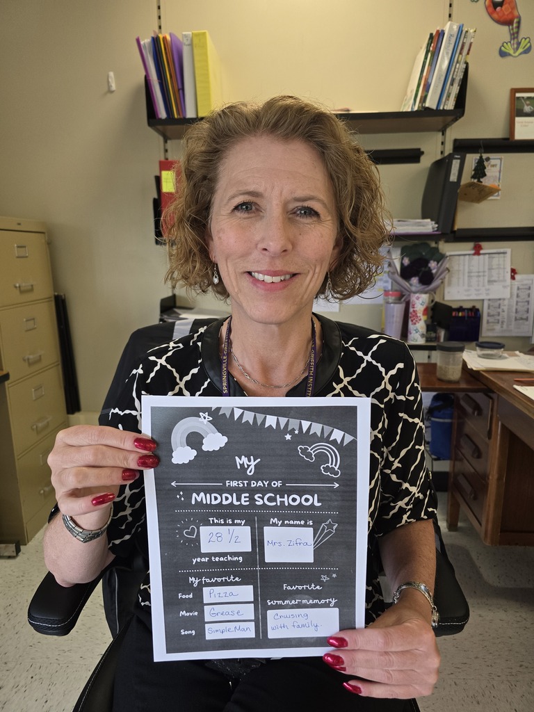 Mrs. Zifra with her back to school flyer