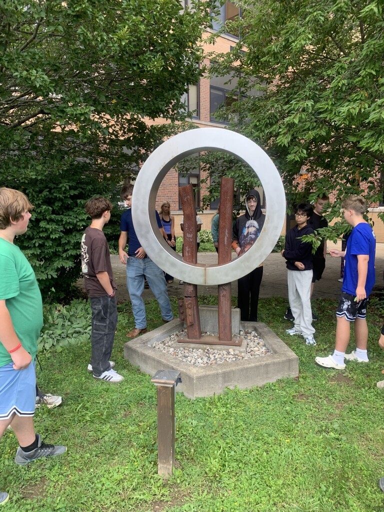 Students at 9-11 Memorial sculpture