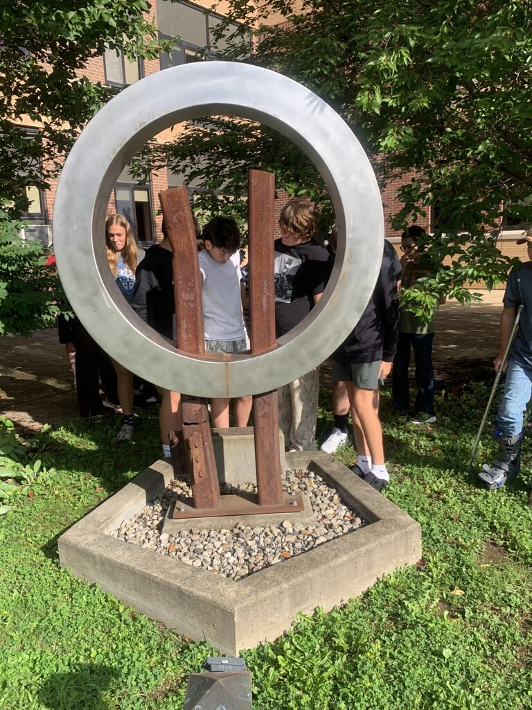 Students at 9-11 Memorial sculpture