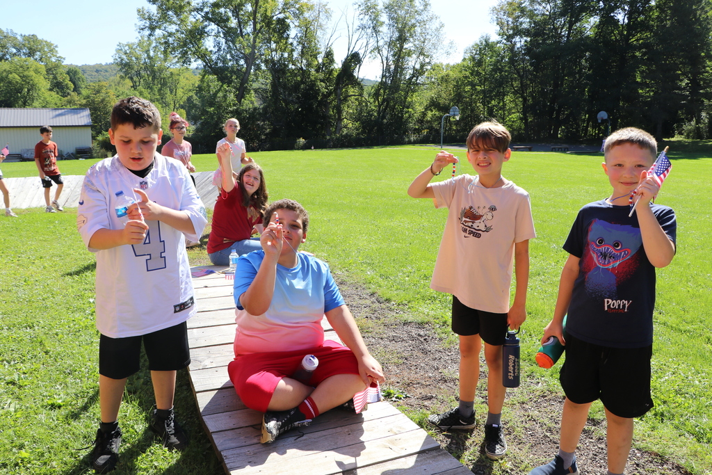 Students hold up their beaded necklaces after the 9-11 remembrance walk