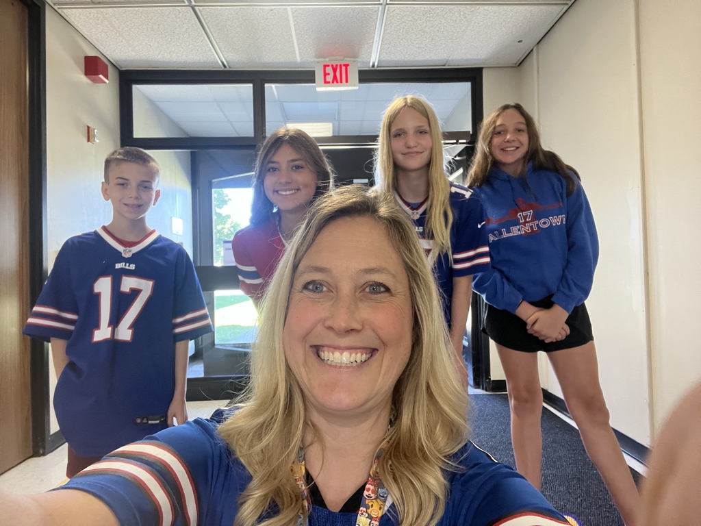 Mrs. Coughlin and students in Bills gear