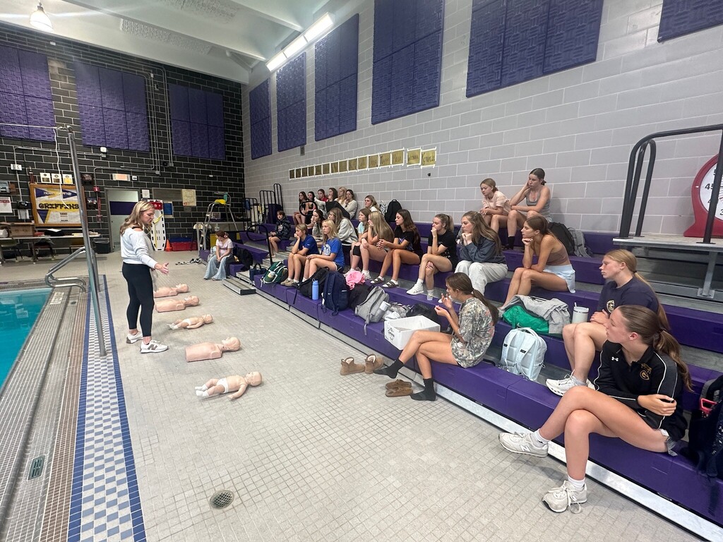 Coach Wozniak speaks to athletes.