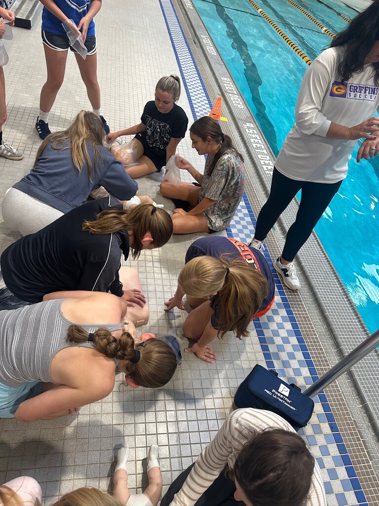 Students practice CPR.