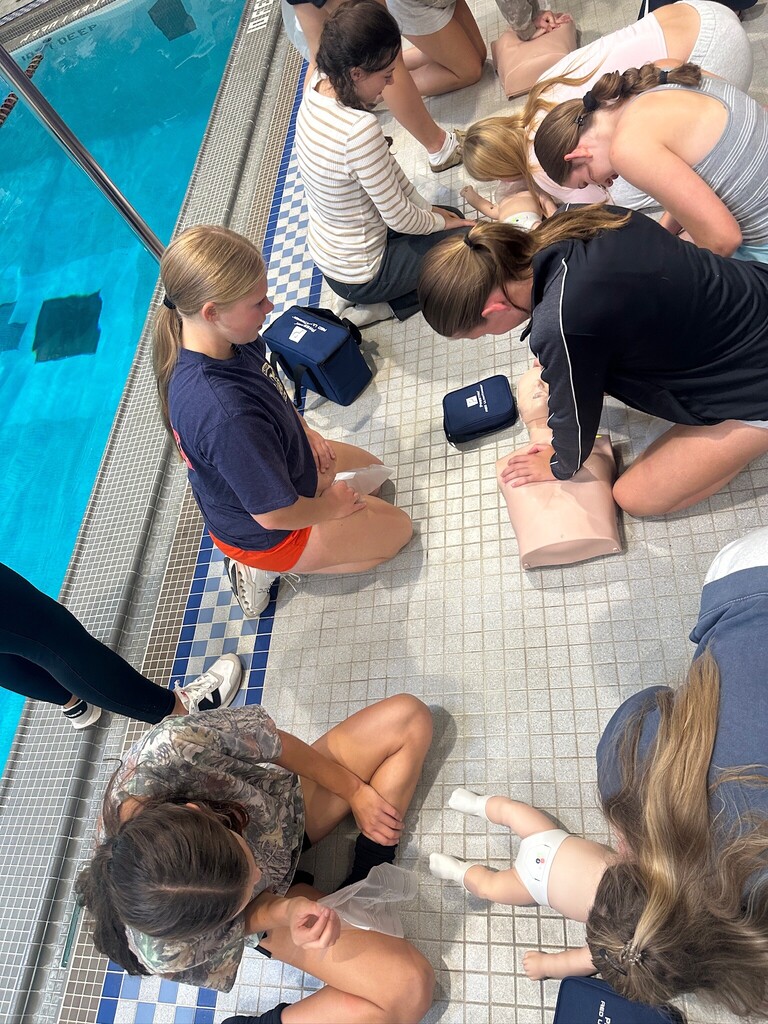 Students practice CPR.