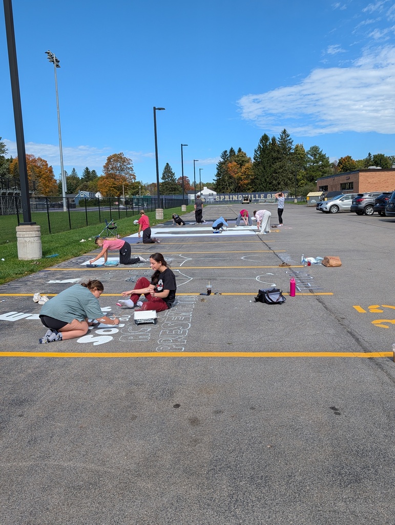 Students paint parking spots 