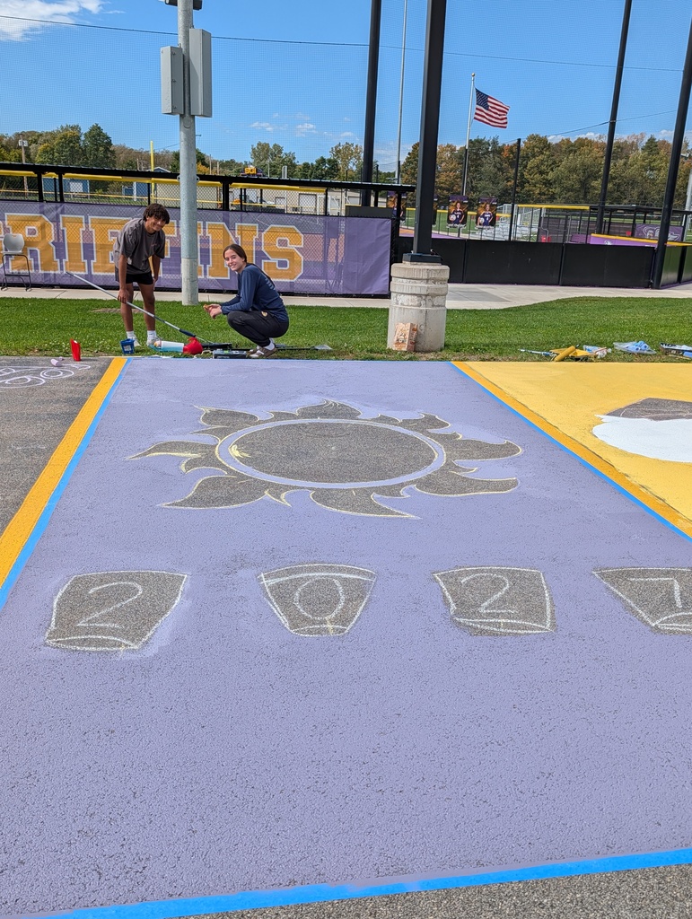 Students paint parking spots 