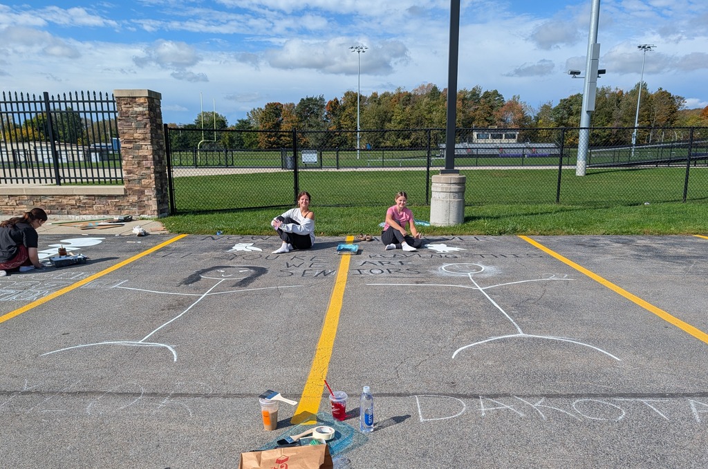Students paint parking spots 