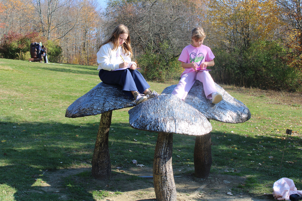 Students on mushrooms sculptures