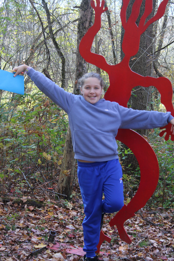 Student with a dancing sculpture
