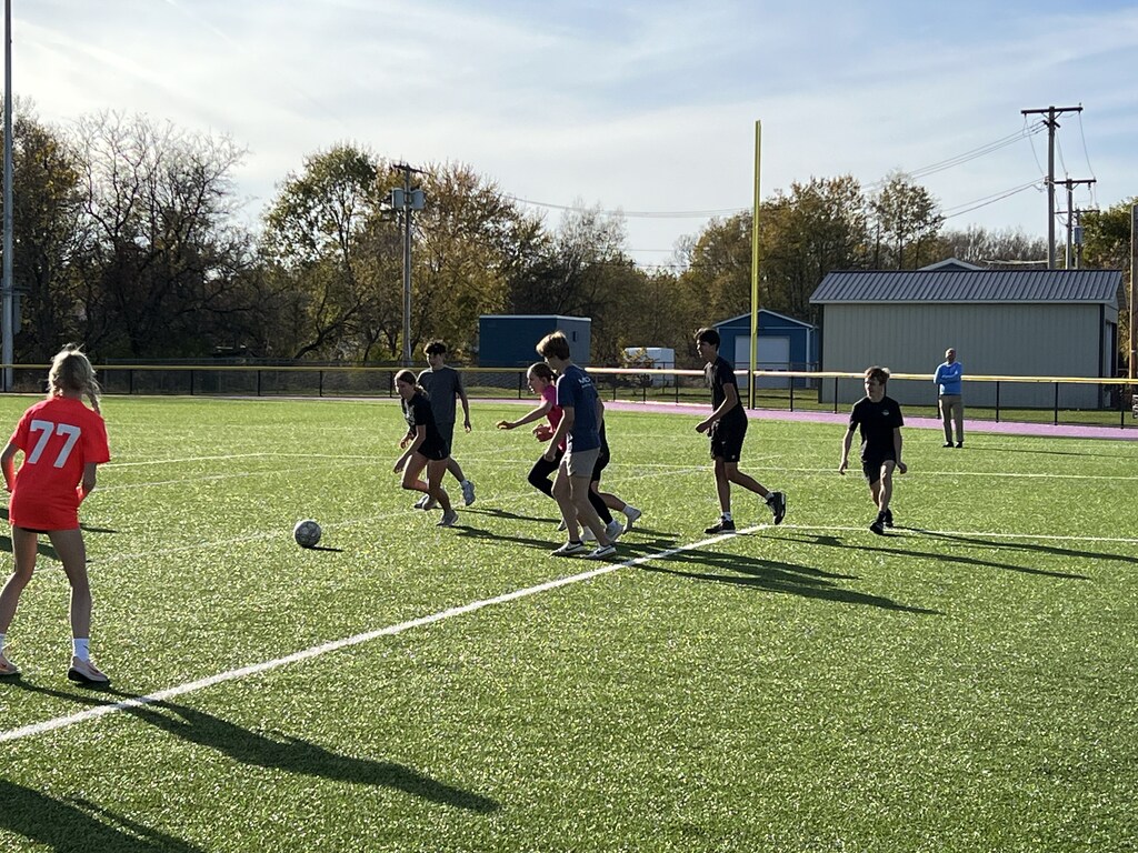 Students play soccer