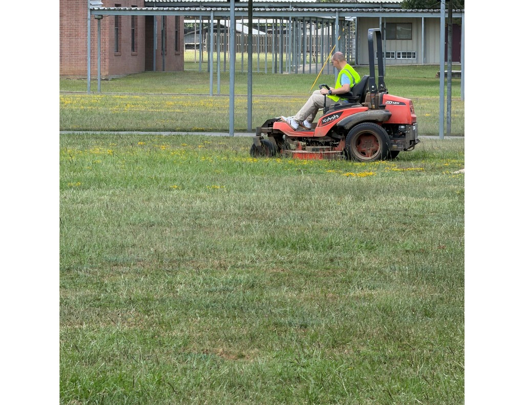 Jeff Burnthorn, superintendent, Mows the lawn at Spurger ISD