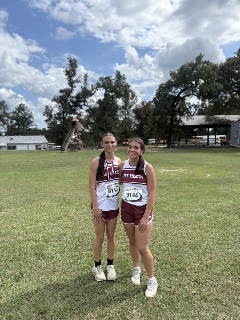 cross country, 2 girls with medals