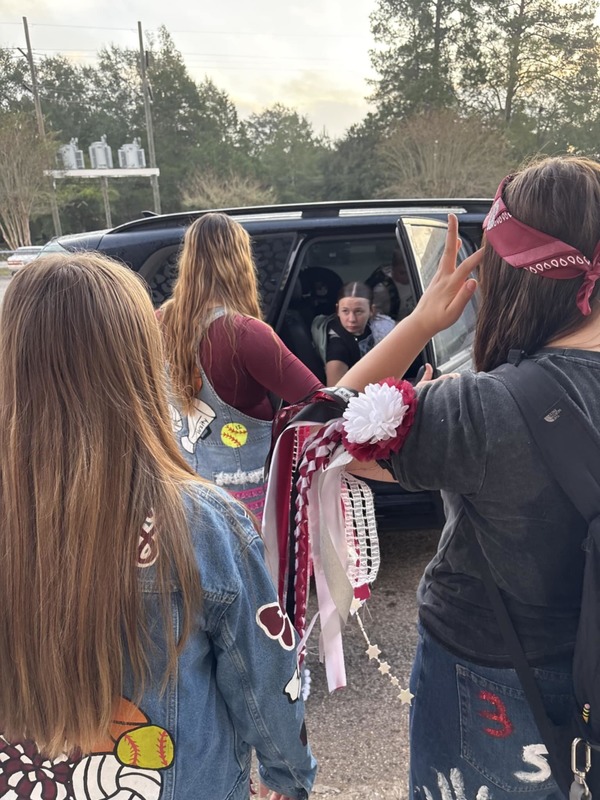 helping student out of the car