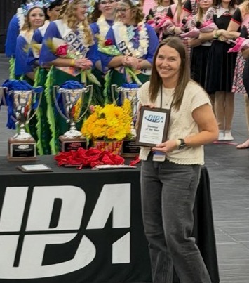TEACHER HOLDING AWARD