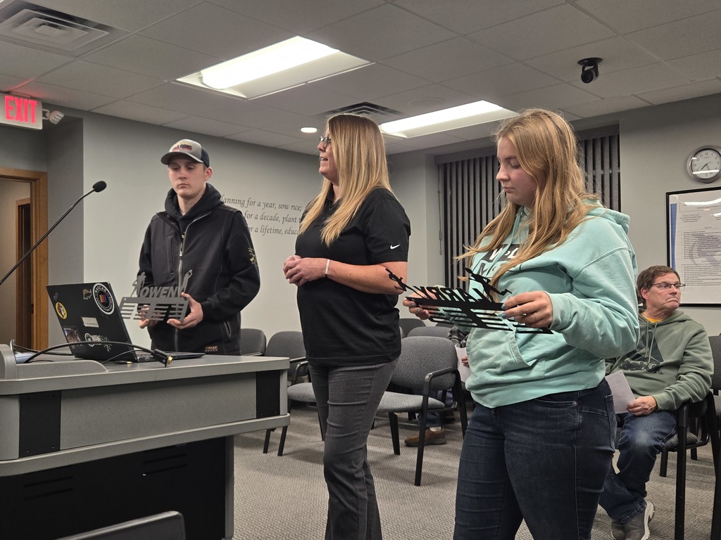 SCC Metals Teacher Brook Reyzer with students Sam & Josh discuss the metals ribbon hanger business start-up